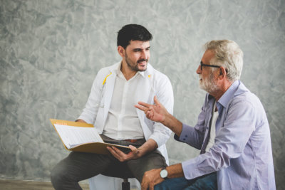 a man talking to the old man