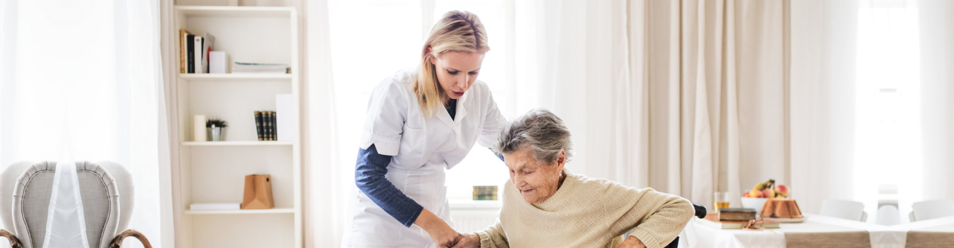 young lady assisting the old woman